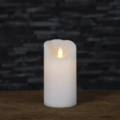 Blockljus med glimmande låga