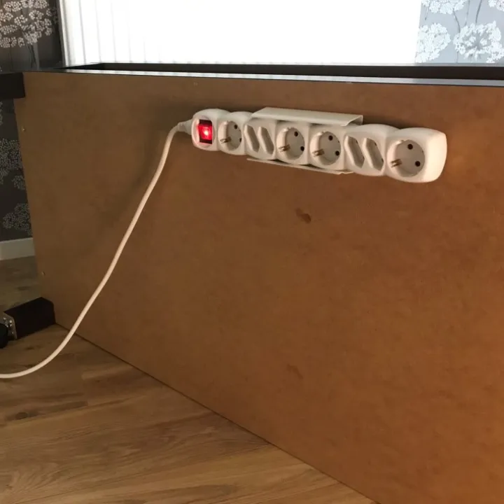 Grenuttagshållare