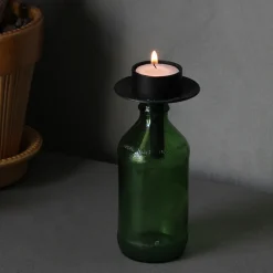 Ljushållare till flaskan